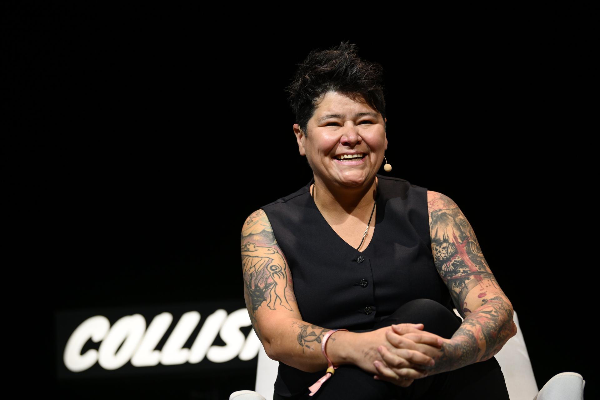 Bobbie Racette smiling on stage.