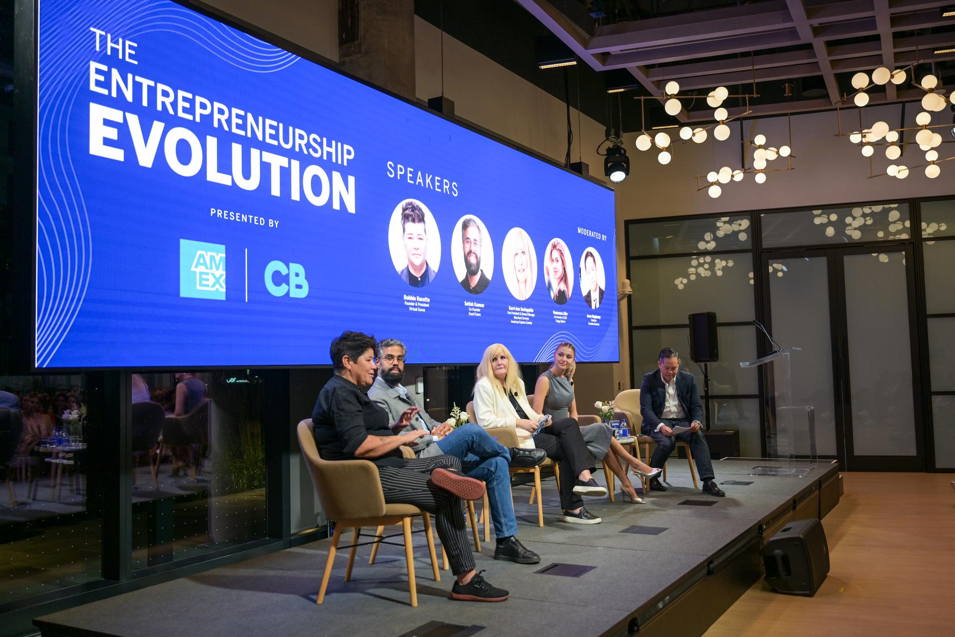 Bobbie Racette seated in a panel of people on stage at an entrepreneurship event.