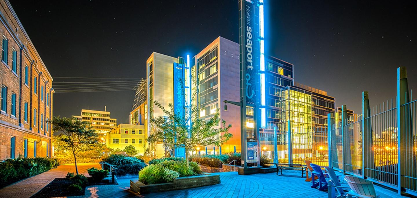 The exterior of the Halifax seaport building at night