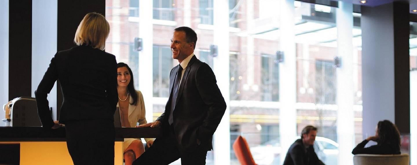 Two smiling people having a casual meeting