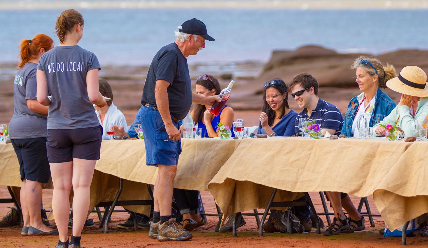 A shared table. Fine wine. Lobster and beef. Each mouthwatering course a synchronized dance between setting sun and rising water