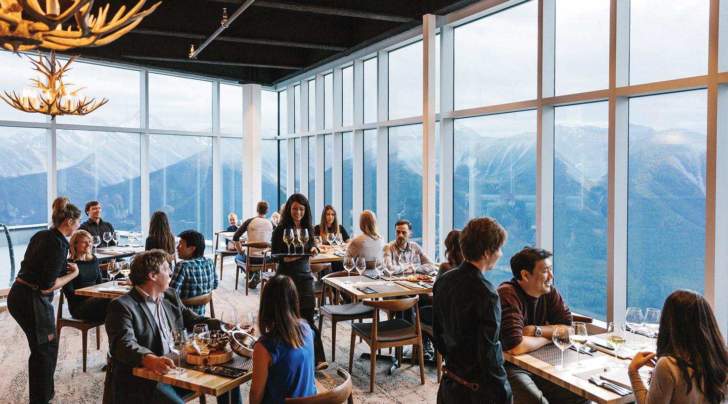 Rocky Mountain modern glass-walled restaurant clings to the summit of Sulphur Mountain